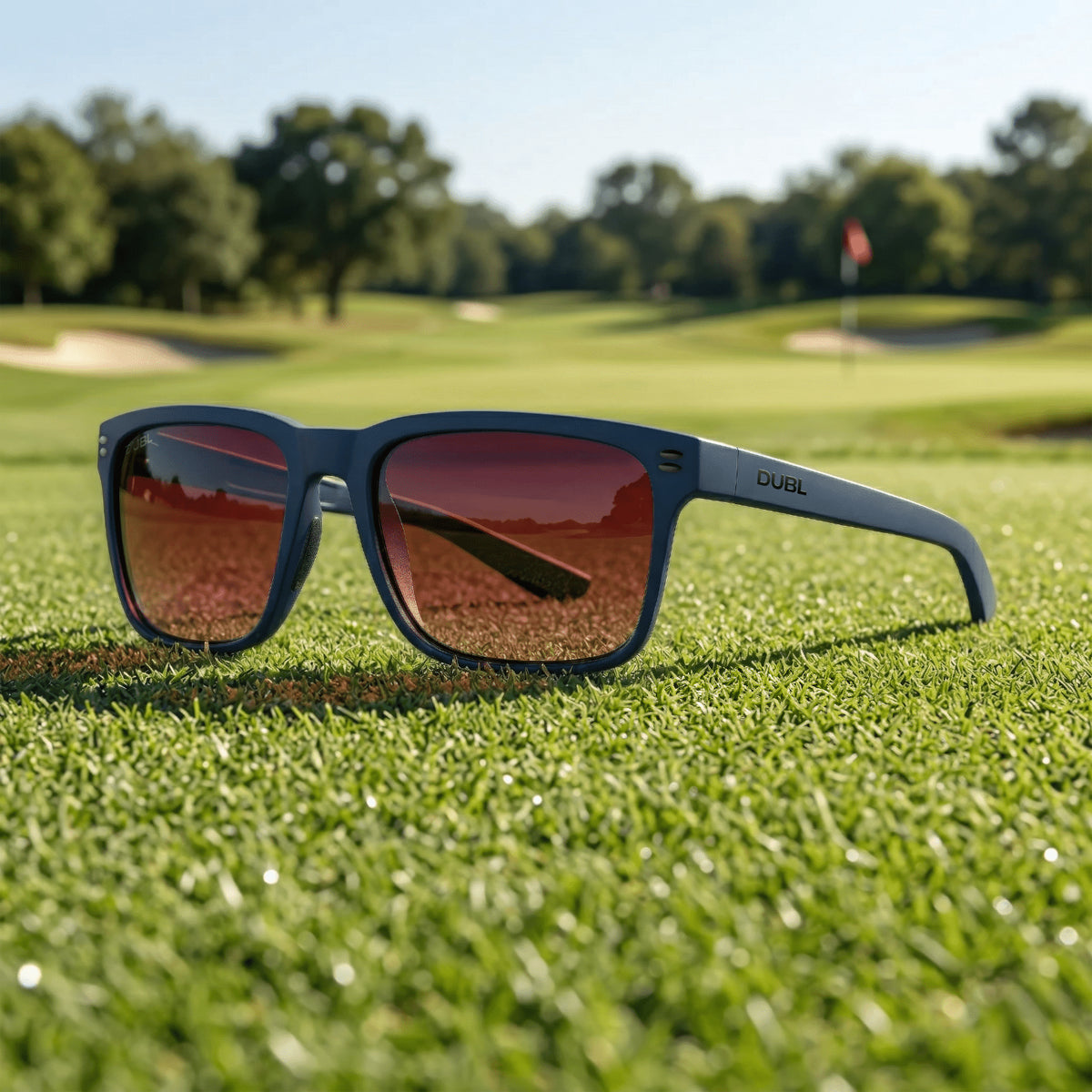 Matte Abyss | Sunglasses with a Abyss frame and red lenses on golf course