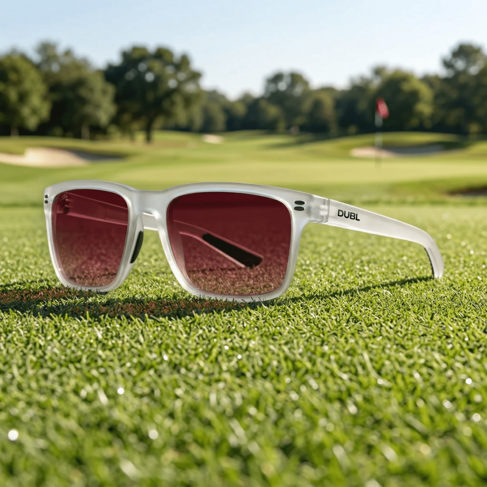 Matte Halo | Sunglasses with a Halo frame and red lenses on golf course